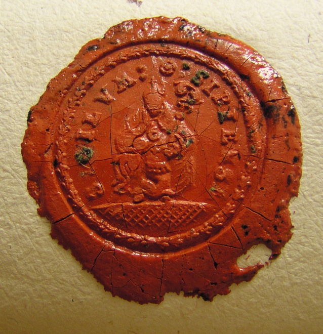 Imprint of the seal of Žirany on the oldest documents dating back to 1772–1778. Its circular text reads: SIGILVM : * : SIRIENSE. Bishop sitting on grass 