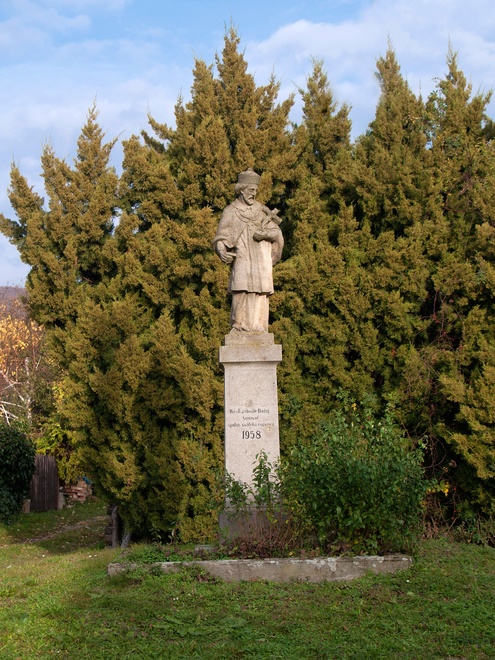 St John of Nepomuk, patron of waters, mariners, millers, and rafters, erected at the border of the Tekov part of Kostolany in the first half of the 19th century. Most probably he was to commemorate floods caused by Drevenica Stream after heavy rains in 1828 
