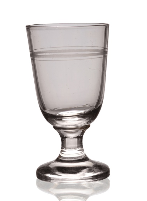 Sheer goblet with slightly conical bowl, matted ring on the rim, small stem on a round foot; blown into a mould, 1860s